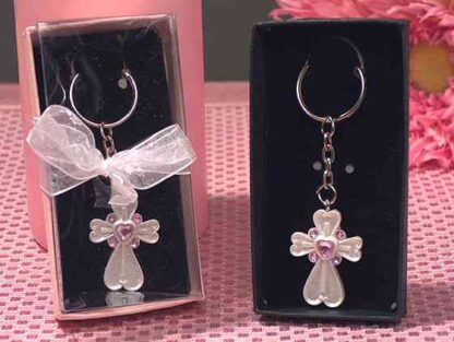 White cross keychain favors with pink color
